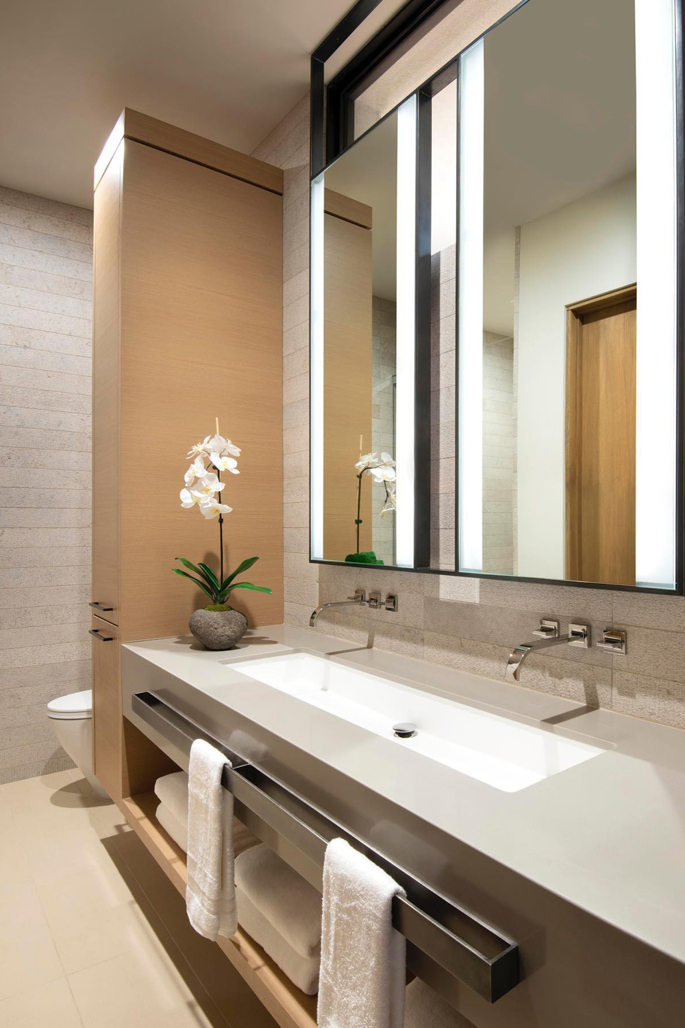 Contemporary double vanity with backlit mirror Arizona renovation
