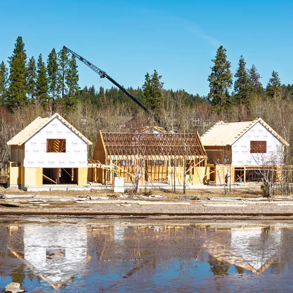 Luxury custom home under construction on Flathead Lake shoreline in Montana by AllHaus