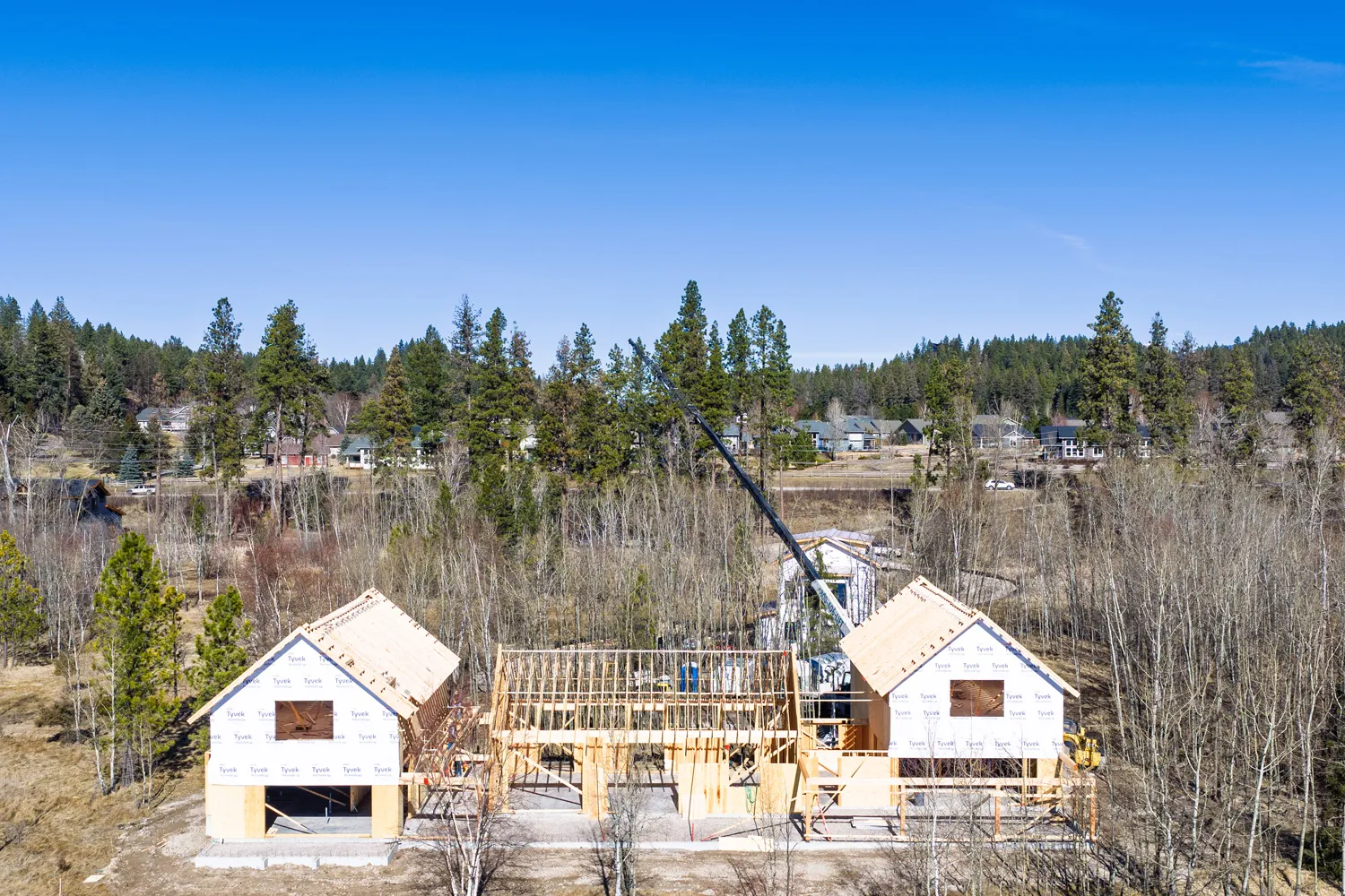 Luxury custom home under construction on Flathead Lake shoreline in Montana by AllHaus