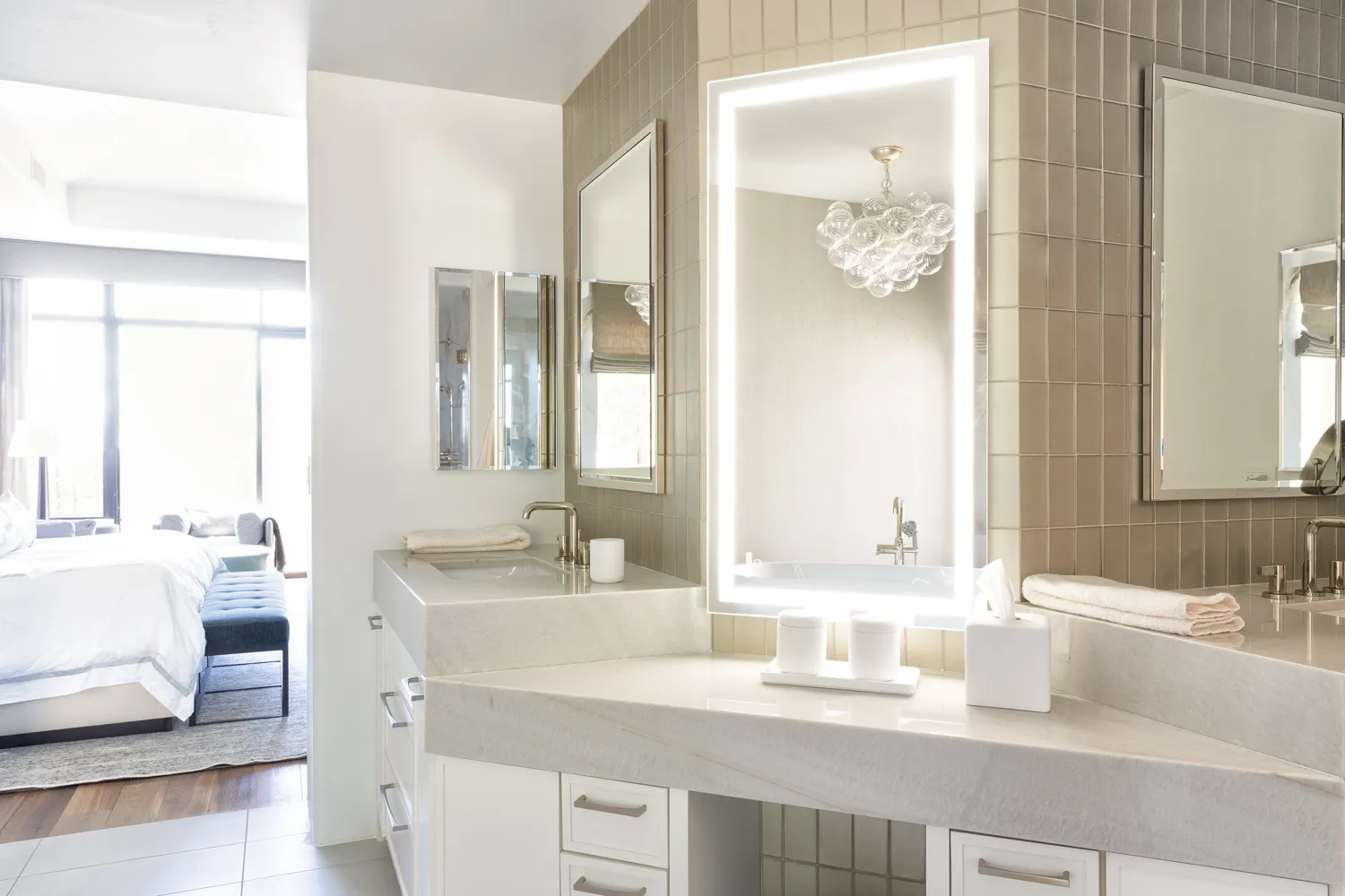 Backlit vanity mirror and custom marble countertop in Arizona bathroom renovation