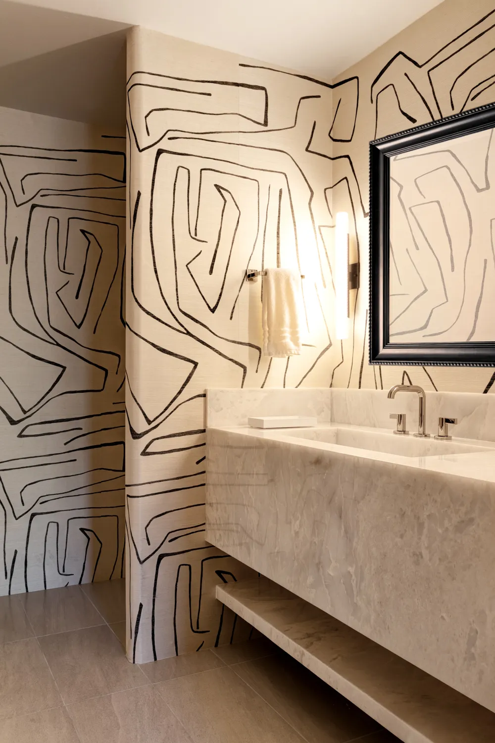 Floating marble vanity with graphic statement wall in contemporary Scottsdale bathroom